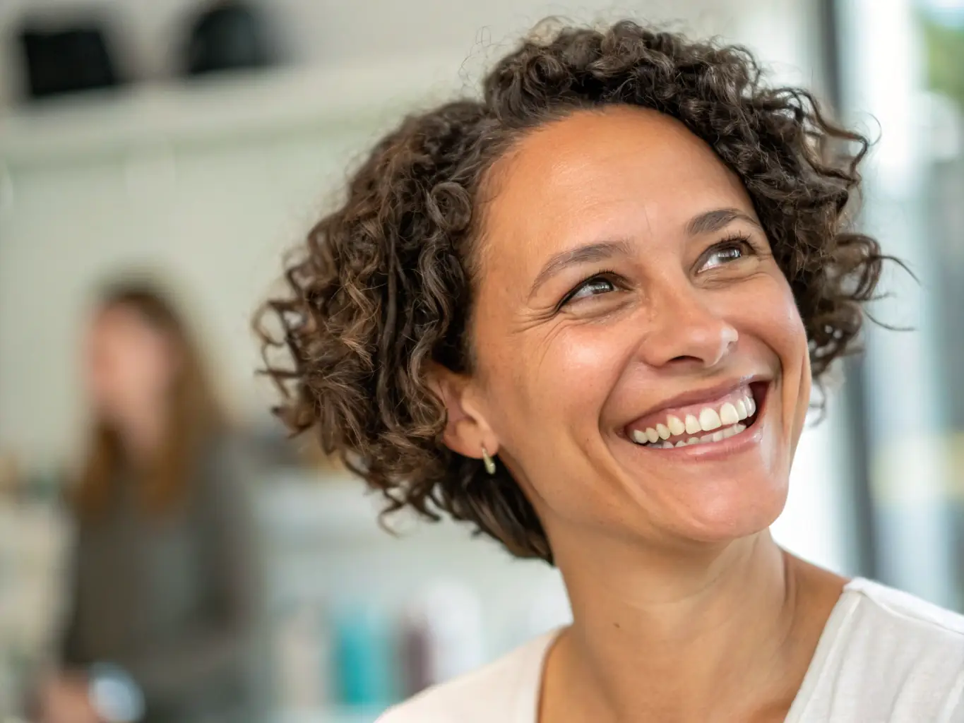 A smiling patient showcasing their successful hair transplant results, highlighting a natural-looking hairline and increased hair density.